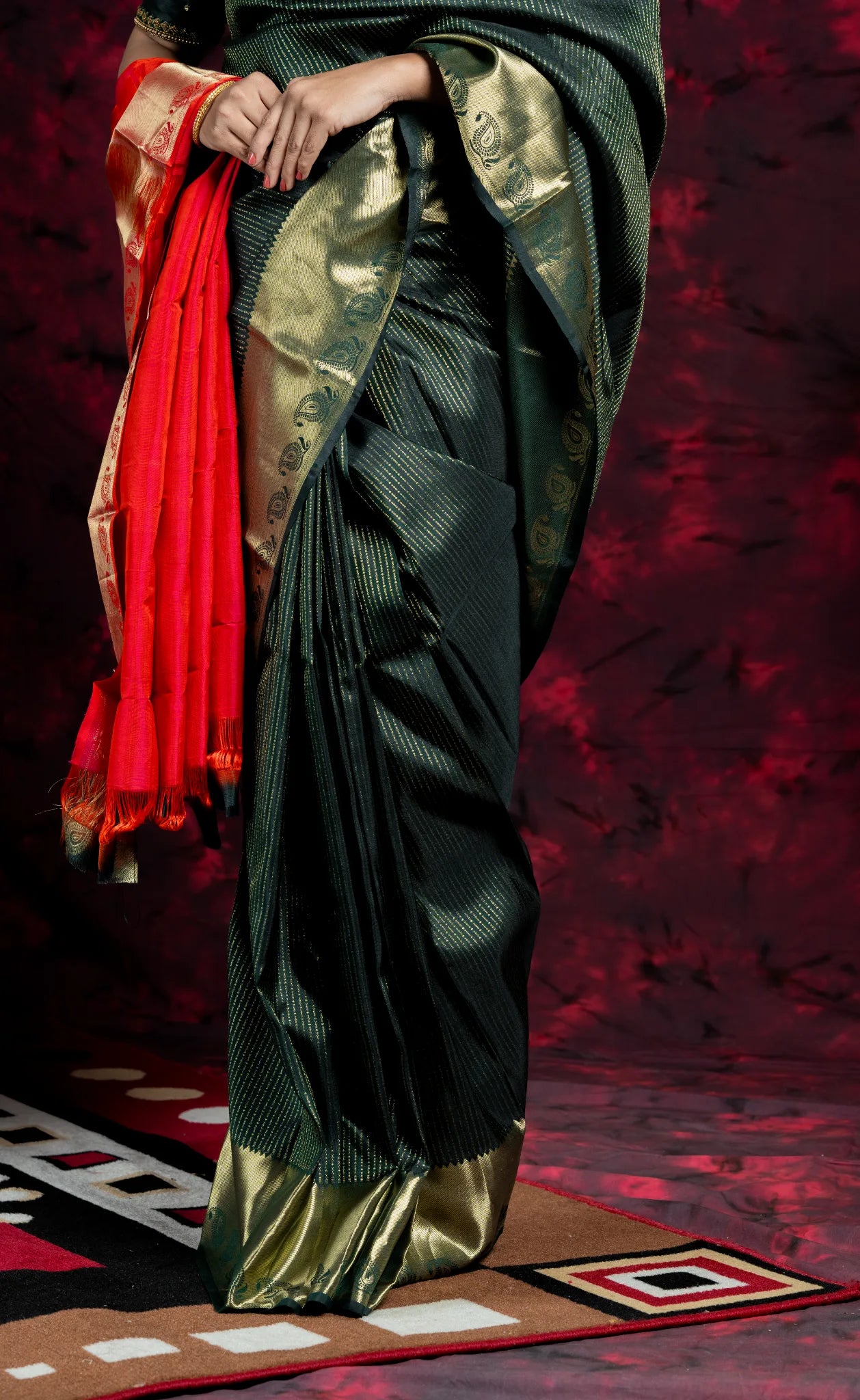 Shrivvi Dark Green Silk Saree With Golden Zarai Work & Orange Pallu