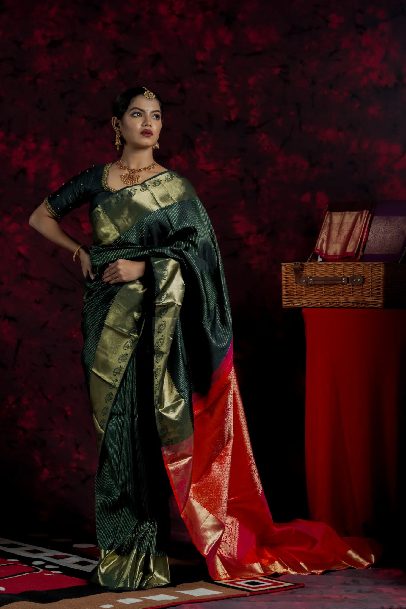 Shrivvi Dark Green Silk Saree With Golden Zarai Work & Orange Pallu