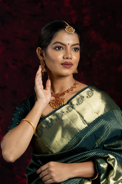 Shrivvi Dark Green Silk Saree With Golden Zarai Work & Orange Pallu