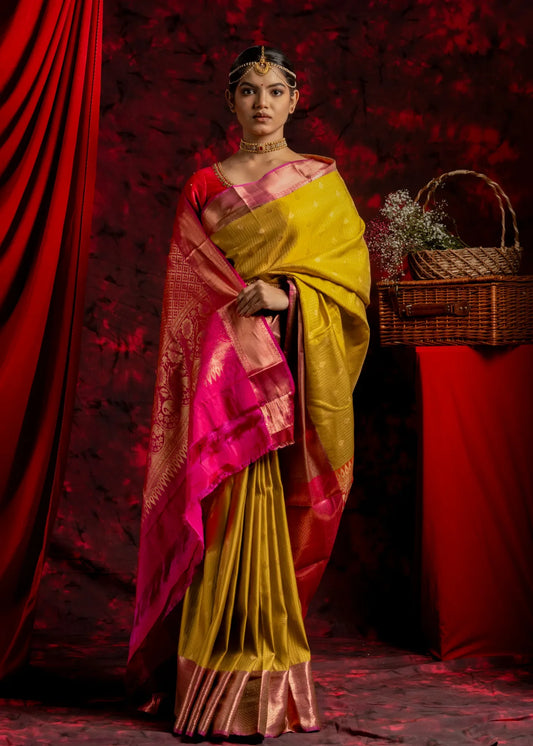 shrivvi-haldi-silk-saree-with-pink-border